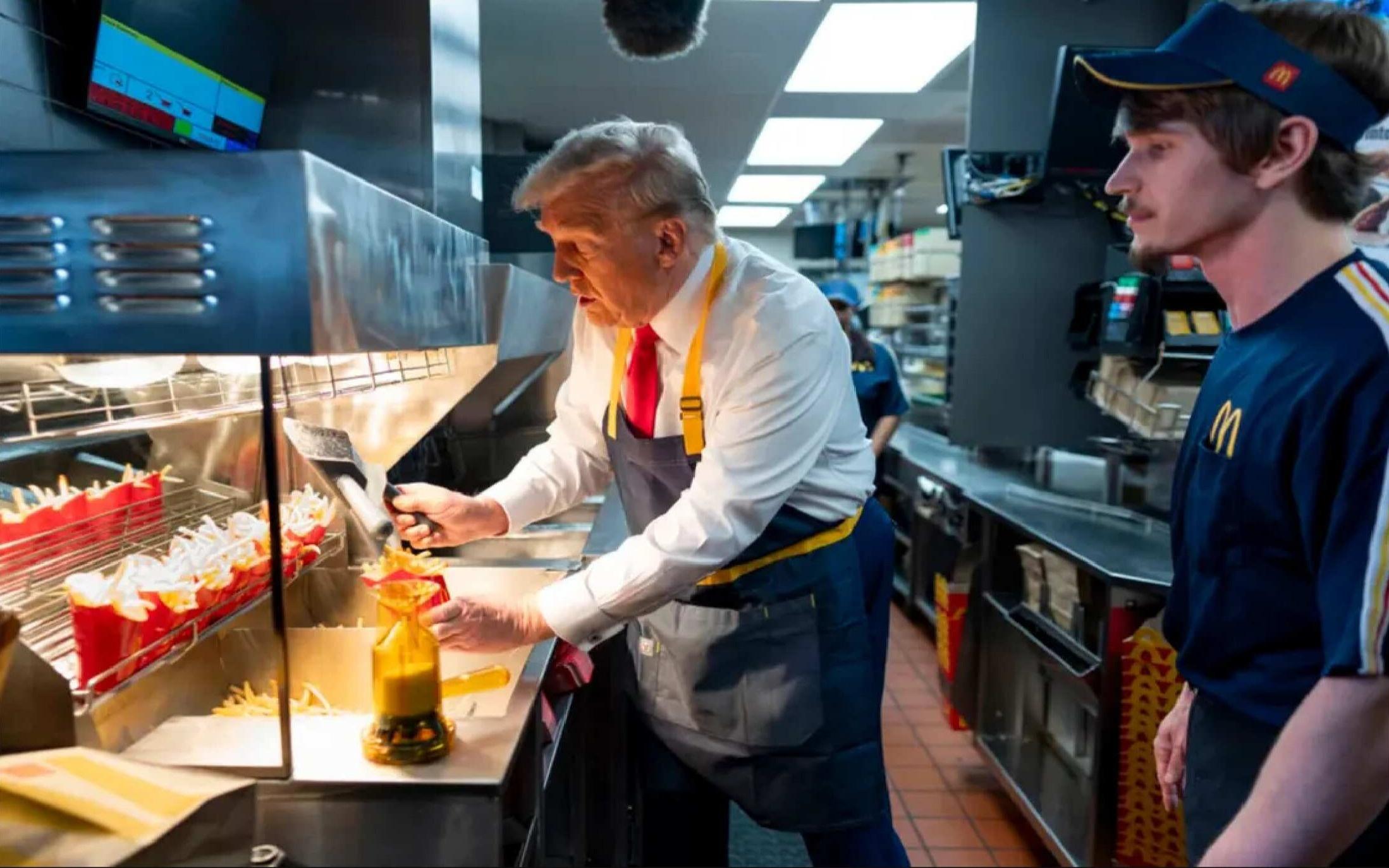 Republican presidential nominee Donald Trump uses a frier during a visit to a McDonald’s outlet in Pennsylvania. (New York Times/AP pic)